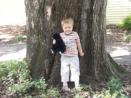 Oak tree by Charles Brady's house, with his great-great-grandson Marcel